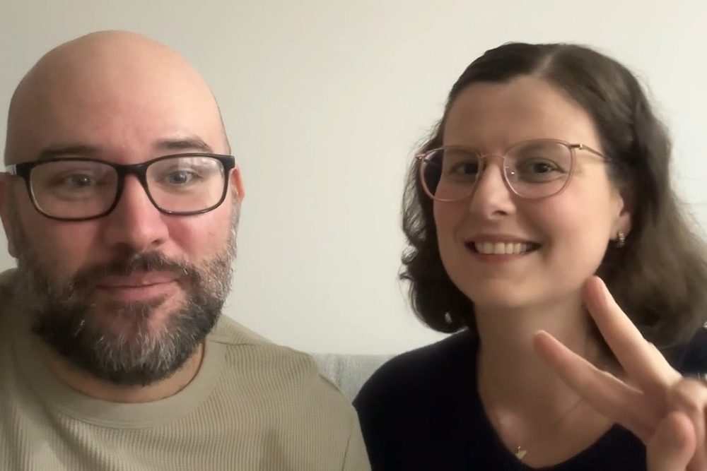 Rob and Elisa from Sogni d'Oro Press, holding the Rio Pinguino Activity Book