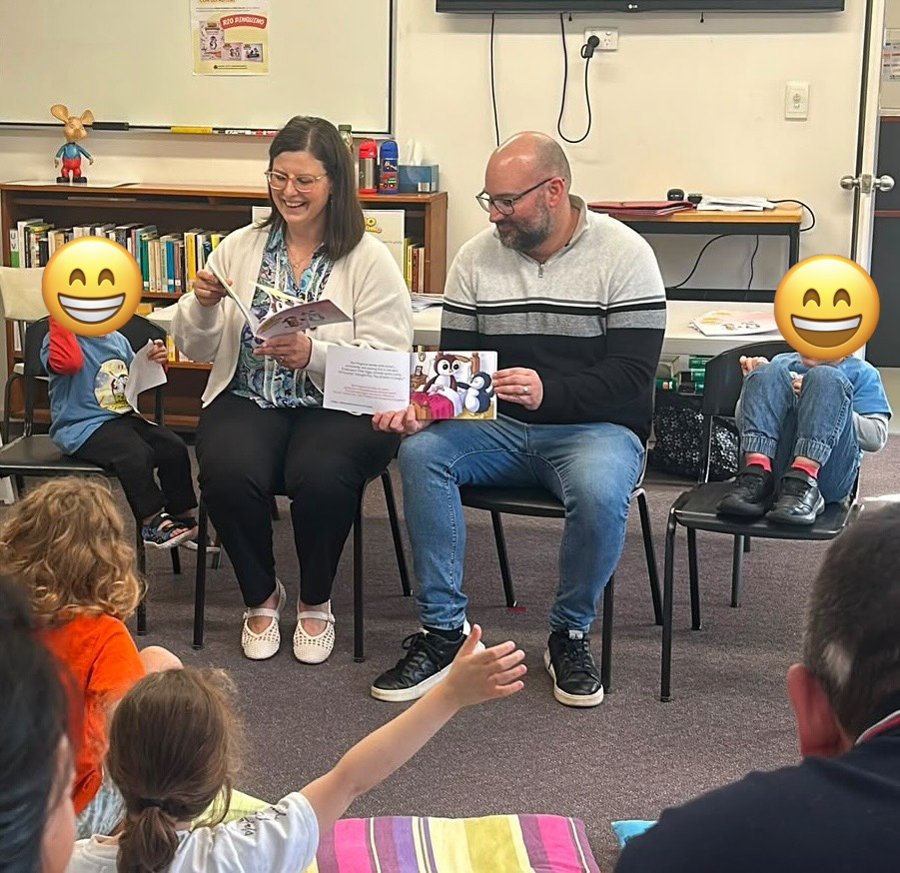 Rob and Elisa reading Rio Pinguino to families at the Dante Alighieri Society